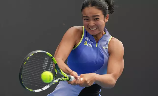 Alexandra Eala of the Philippines plays a backhand return to Alycia Parks of the U.S. during their first round match at the Australian Open tennis championship in Melbourne, Australia, Monday, Jan. 19, 2026. (AP Photo/Dar Yasin)