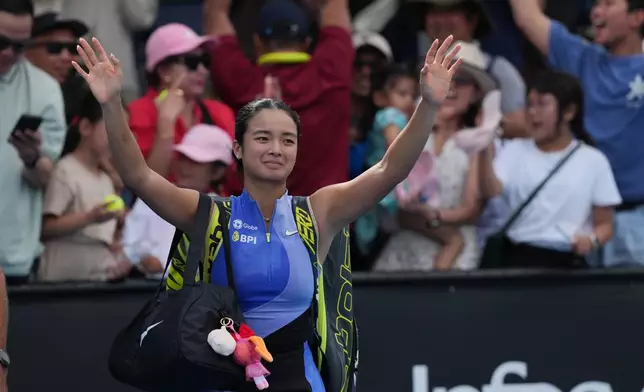 Alexandra Eala of the Philippines waves to her supporters following her first round loss to Alycia Parks of the U.S. at the Australian Open tennis championship in Melbourne, Australia, Monday, Jan. 19, 2026. (AP Photo/Dar Yasin))