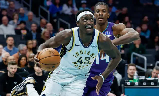 Indiana Pacers forward Pascal Siakam (43) drives to the basket against Charlotte Hornets forward Moussa Diabate during the first half of an NBA basketball game in Charlotte, N.C., Thursday, Jan. 8, 2026. (AP Photo/Nell Redmond)