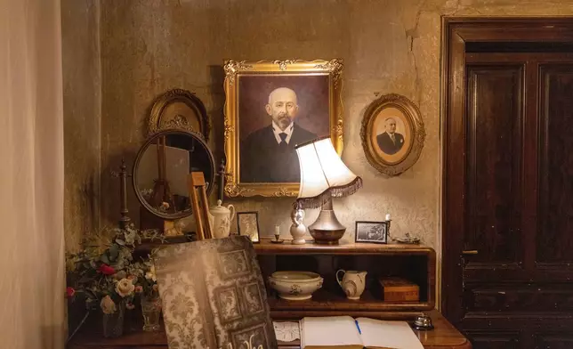 Pieces of furniture and portraits are seen in an old villa used for theater performances by an independent theater production, in Belgrade, Serbia, Sunday, Jan. 18, 2026. (AP Photo/Marko Drobnjakovic)