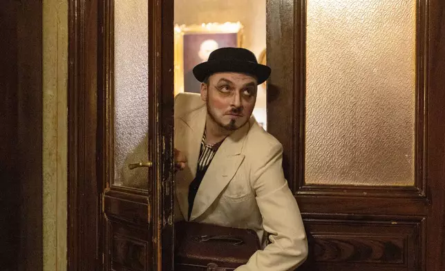 Dragomir Kadovic, an amateur actor, poses for a photograph in an old villa used for theater performances by an independent theater production, in Belgrade, Serbia, Sunday, Jan. 18, 2026. (AP Photo/Marko Drobnjakovic)