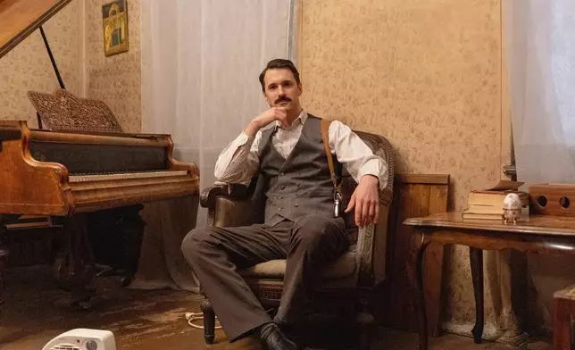 Milan Vukajlovic, an amateur actor, poses for a photograph in an old villa used for theater performances by an independent theater production, in Belgrade, Serbia, Sunday, Jan. 18, 2026. (AP Photo/Marko Drobnjakovic)