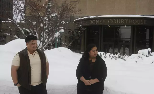 Michael Pese and his wife, Tupe Smith, stand outside the Boney Courthouse in Anchorage, Alaska, Thursday, Jan. 15, 2026, ahead of the Alaska Court of Appeals hearing a challenge to the voter fraud case brought against her by the state. (AP Photo/Mark Thiessen)