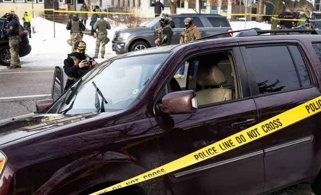 A bullet hole and blood stains are seen in a crashed vehicle on at the scene of a shooting in Minneapolis on Wednesday, Jan. 7, 2026. (Ben Hovland/Minnesota Public Radio via AP)