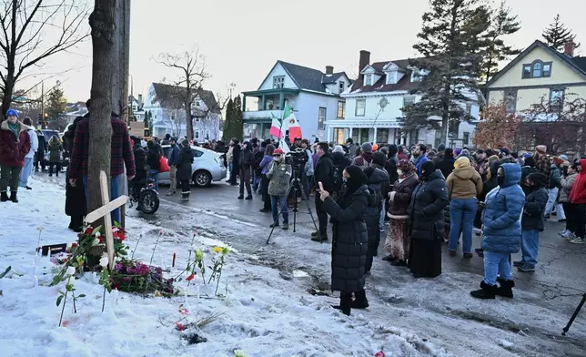 Protesters gather near the scene of the fatal shooting involving federal law enforcement agents, Wednesday, Jan. 7, 2026, in Minneapolis. (AP Photo/Tom Baker)