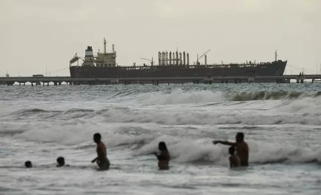 Evana, an oil tanker, is docked at El Palito port in Puerto Cabello, Venezuela, Sunday, Dec. 21, 2025. (AP Photo/Matias Delacroix)