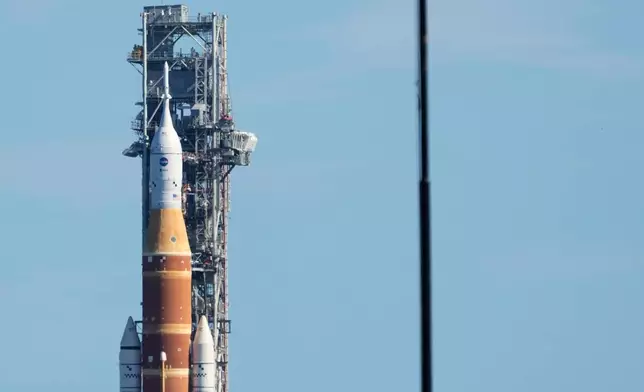 NASA's new moon rocket, Artemis II, makes its way from the Vehicle Assembly Building to pad 39B at the Kennedy Space Center, Saturday, Jan. 17, 2026, in Cape Canaveral, Fla. (AP Photo/John Raoux)