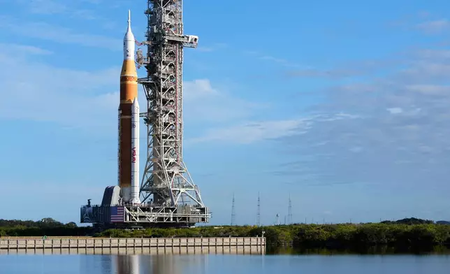 NASA's new moon rocket, Artemis II, makes its way from the Vehicle Assembly Building to pad 39B at the Kennedy Space Center, Saturday, Jan. 17, 2026, in Cape Canaveral, Fla. (AP Photo/John Raoux)