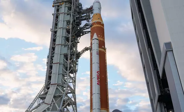 The Artemis II rocket makes its way from the Vehicle Assembly Building to pad 39B at the Kennedy Space Center, Saturday, Jan. 17, 2026, in Cape Canaveral, Fla. (AP Photo/John Raoux)