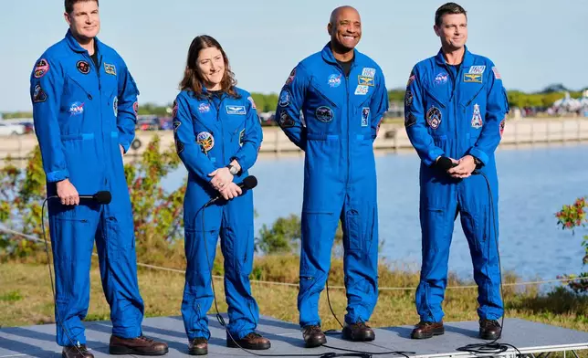 The crew of the new NASA moon rocket, Artemis II, take part in a news conference, from left, Canadian Space Agency astronaut Jeremy Hansen, mission specialist, Christina Koch, pilot Victor Glover and commander Reid Wiseman at the Kennedy Space Center, Saturday, Jan. 17, 2026, in Cape Canaveral, Fla. (AP Photo/John Raoux)