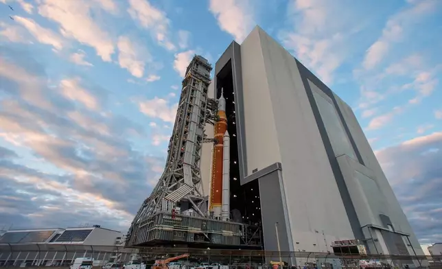 The Artemis II rocket makes its way from the Vehicle Assembly Building to pad 39B at the Kennedy Space Center, Saturday, Jan. 17, 2026, in Cape Canaveral, Fla. (AP Photo/John Raoux)
