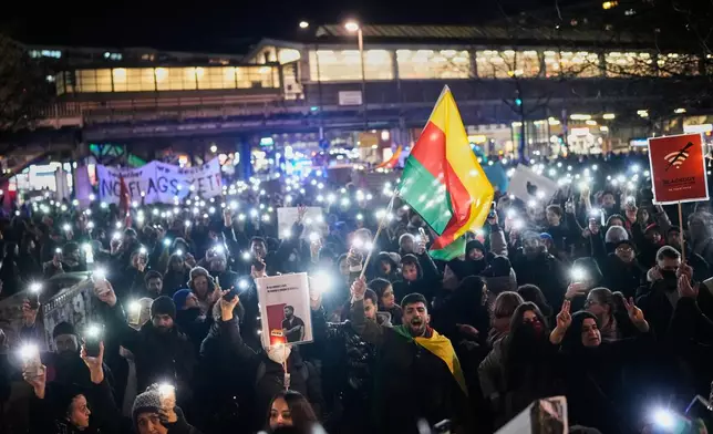 Protesters participate in a demonstration in support of the nationwide mass protests in Iran against the government, in Berlin, Germany, Wednesday, Jan. 14, 2026. (AP Photo/Ebrahim Noroozi)