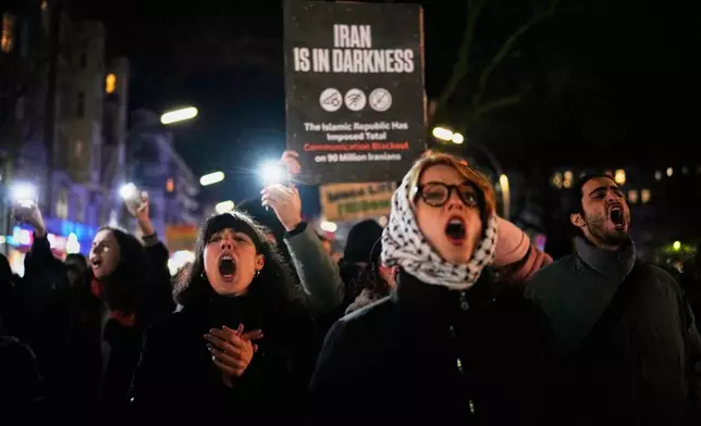 Protesters participate in a demonstration in support of the nationwide mass protests in Iran against the government, in Berlin, Germany, Wednesday, Jan. 14, 2026. (AP Photo/Ebrahim Noroozi)