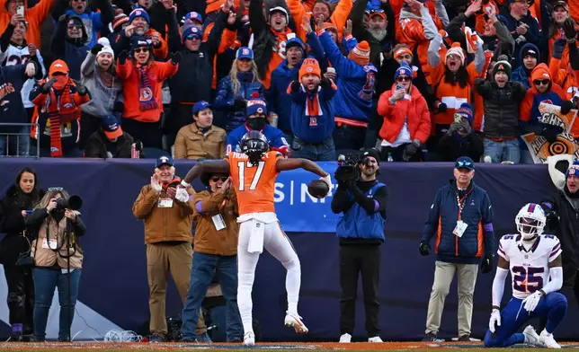 Denver Broncos wide receiver Lil'jordan Humphrey (17) celebrates after a touchdown during the first half of an NFL divisional round playoff football game against the Buffalo Bills, Saturday, Jan. 17, 2026, in Denver. (AP Photo/RJ Sangosti)