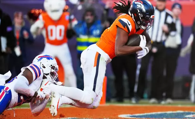 during the first half of an NFL divisional round playoff football game, Saturday, Jan. 17, 2026, in Denver. (AP Photo/Jack Dempsey)