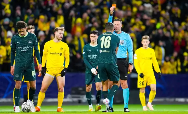 Manchester City's Rodri is shown a red card by referee Sven Jablonski during the Champions League soccer match between Bodo/Glimt and Manchester City in Bodo, Norway, Tuesday, Jan. 20, 2026. (Fredrik Varfjell/NTB via AP)