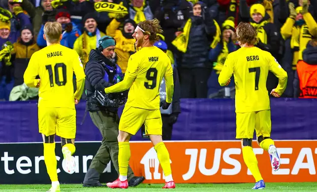Glimt's Kasper Hogh celebrates after scoring during the Champions League soccer match between Bodo/Glimt and Manchester City in Bodo, Norway, Tuesday, Jan. 20, 2026. (Fredrik Varfjell/NTB via AP)