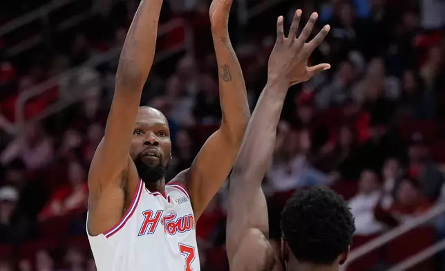 Houston Rockets forward Kevin Durant (7) shoots against New Orleans Pelicans center Yves Missi (21) during the second half of an NBA basketball game in Houston, Sunday, Jan. 18, 2026. (AP Photo/Ashley Landis)