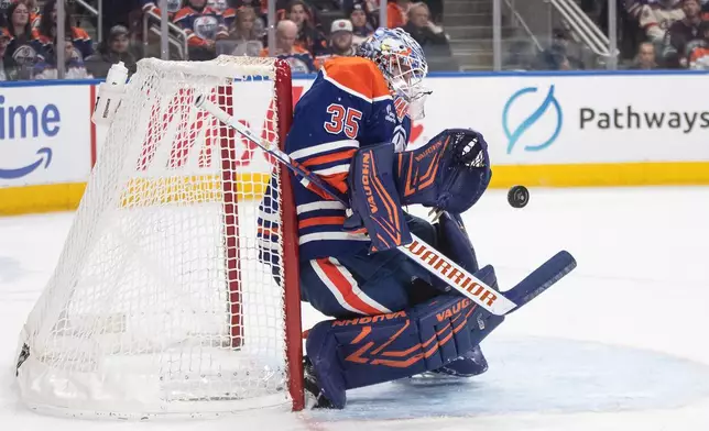 Edmonton Oilers goalie Tristan Jarry makes a save against the Anaheim Ducks during third-period NHL hockey game action in Edmonton, Alberta, Monday, Jan. 26, 2026. (Jason Franson/The Canadian Press via AP)