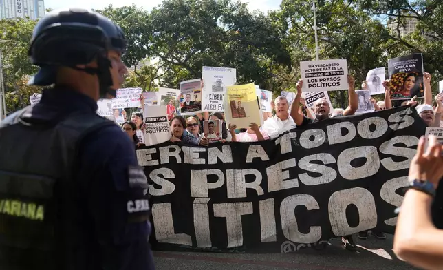 Relatives and human rights activists rally outside the Attorney General's Office in Caracas, Venezuela, Tuesday, Jan. 20, 2026, calling for the release of people they consider to be detained for political reasons. (AP Photo/Ariana Cubillos)