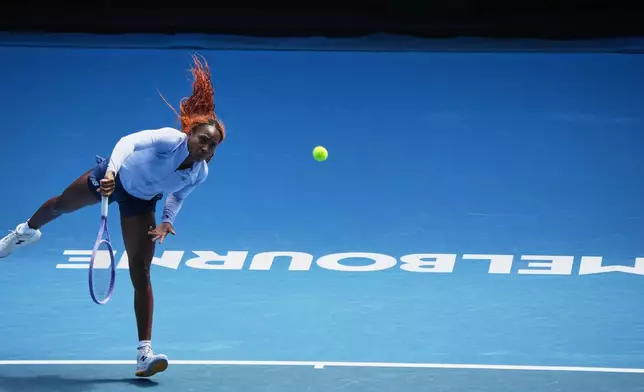 Coco Gauff of the United States serves during a practice session ahead of the Australian Open tennis championship in Melbourne, Australia, Friday, Jan. 16, 2026. (AP Photo/Dita Alangkara)
