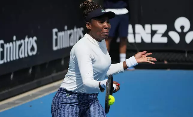 Venus Williams of the United States plays a forehand return to during a practice session ahead of the Australian Open tennis championship in Melbourne, Australia, Friday, Jan. 16, 2026. (AP Photo/Dita Alangkara)