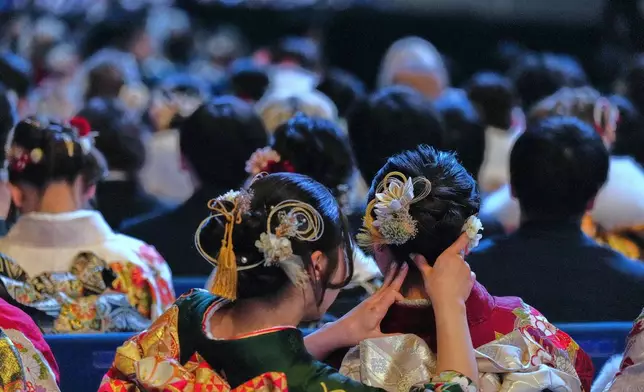 Young adults attend the ceremony to celebrate the Coming-of-Age Day, a centuries-old tradition and national holiday marking the milestone from childhood to adulthood, Monday, Jan. 12, 2026, in Yokohama near Tokyo. (AP Photo/Eugene Hoshiko).