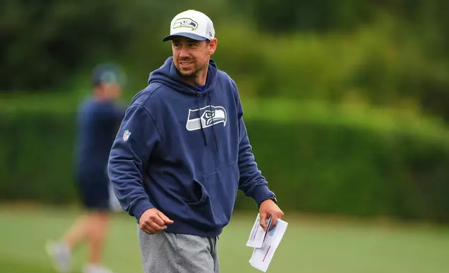 FILE - Seattle Seahawks offensive coordinator Klint Kubiak walks on the field during the NFL football team's training camp July 26, 2025, in Renton, Wash. (AP Photo/Lindsey Wasson, File)