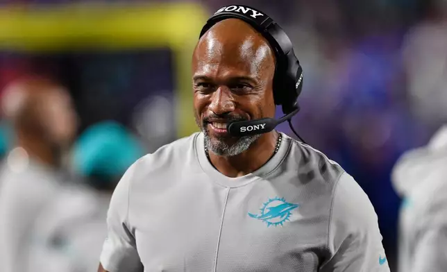 FILE - Miami Dolphins defensive coordinator Anthony Weaver walks on the sideline during the second half of an NFL football game against the Buffalo Bills, Thursday, Sept. 18, 2025, in Orchard Park, N.Y. (AP Photo/Adrian Kraus, File)