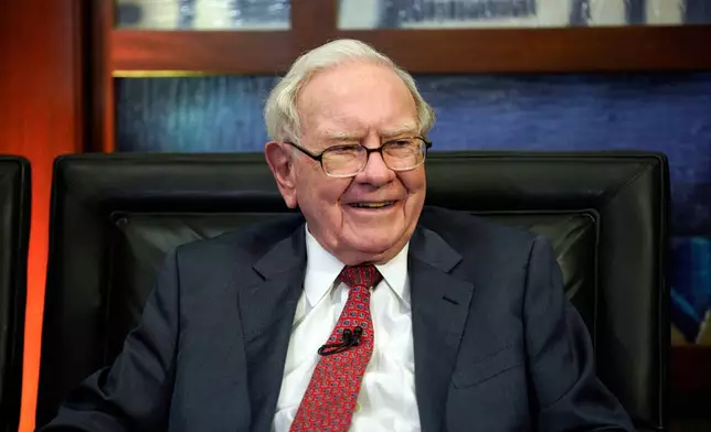 FILE- In this May 7, 2018, file photo, Berkshire Hathaway Chairman and CEO Warren Buffett smiles during an interview in Omaha, Neb.. (AP Photo/Nati Harnik, File)