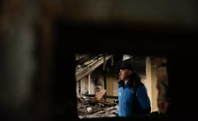 Biathlon coach Mykola Vorchak, 60, speaks during an interview with The Associated Press in the Chernihiv, Ukraine ski base, which was destroyed following Russian attacks in 2022, Thursday, Oct. 30, 2025. (AP Photo/Julia Demaree Nikhinson)