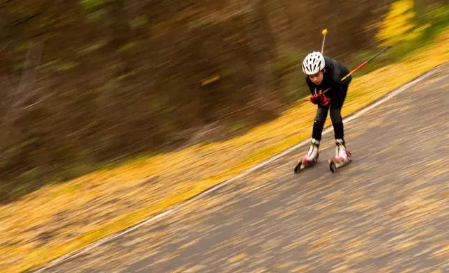 Biathlete Nazar Kravchenko, 12, trains at the ski base in Chernihiv, Ukraine, Thursday, Oct. 30, 2025. (AP Photo/Julia Demaree Nikhinson)