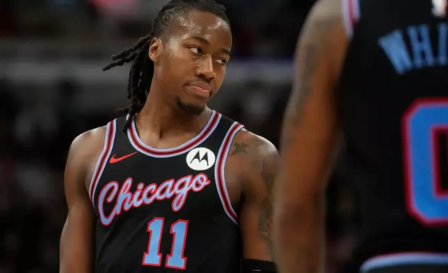 Chicago Bulls guard Ayo Dosunmu (11) reacts after a foul is called on him during the first half of an NBA basketball game against the Miami Heat, Thursday, Jan. 29, 2026, in Chicago. (AP Photo/Erin Hooley)