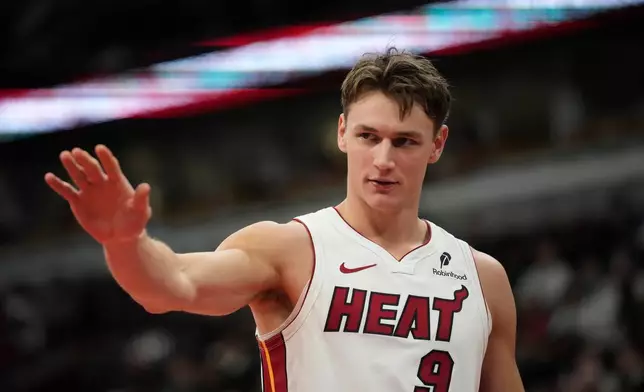 Miami Heat guard Pelle Larsson waves to the bench after getting fouled by the Chicago Bulls during the first half of an NBA basketball game, Thursday, Jan. 29, 2026, in Chicago. (AP Photo/Erin Hooley)