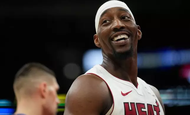 Miami Heat center Bam Adebayo (13) looks back at the bench after drawing a foul from the Chicago Bulls during the second half of an NBA basketball game Thursday, Jan. 29, 2026, in Chicago. (AP Photo/Erin Hooley)