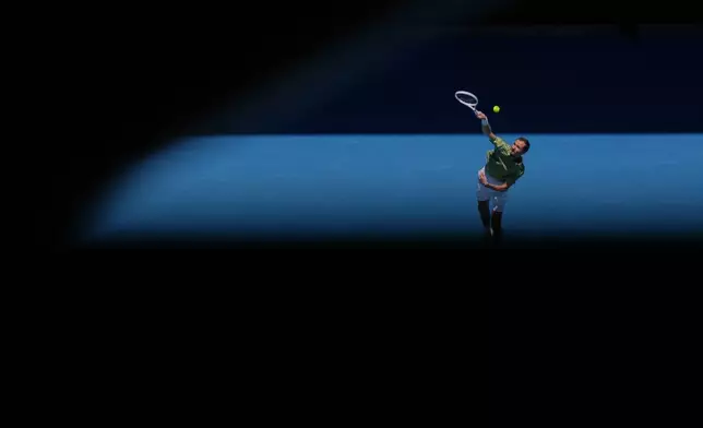 Daniil Medvedev of Russia serves to Jesper de Jong of the Netherlands during their first round match at the Australian Open tennis championship in Melbourne, Australia, Monday, Jan. 19, 2026. (AP Photo/Dita Alangkara)