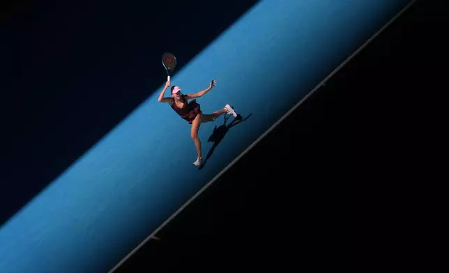 Anastasia Potapova of Austria plays a forehand return to Aryna Sabalenka of Belarus during their third round match at the Australian Open tennis championship in Melbourne, Australia, Friday, Jan. 23, 2026. (AP Photo/Asanka Brendon Ratnayake)