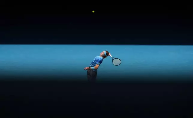 Andrey Rublev of Russia serves to Jaime Faria of Portugal during their second round match at the Australian Open tennis championship in Melbourne, Australia, Wednesday, Jan. 21, 2026. (AP Photo/Asanka Brendon Ratnayake)