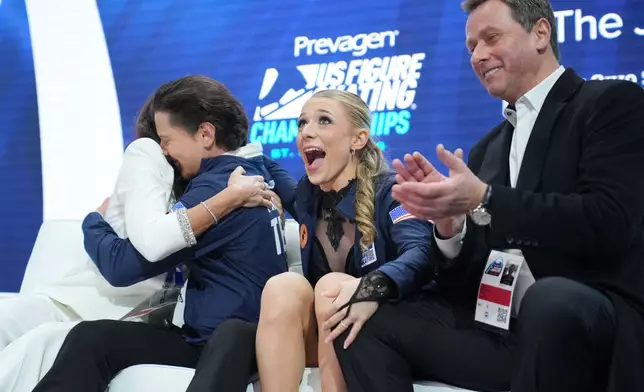 Emilea Zingas and Vadym Kolesnik react to their scores after the free dance competition at the U.S. Figure Skating Championships, Saturday, Jan. 10, 2026, in St. Louis. (AP Photo/Stephanie Scarbrough)