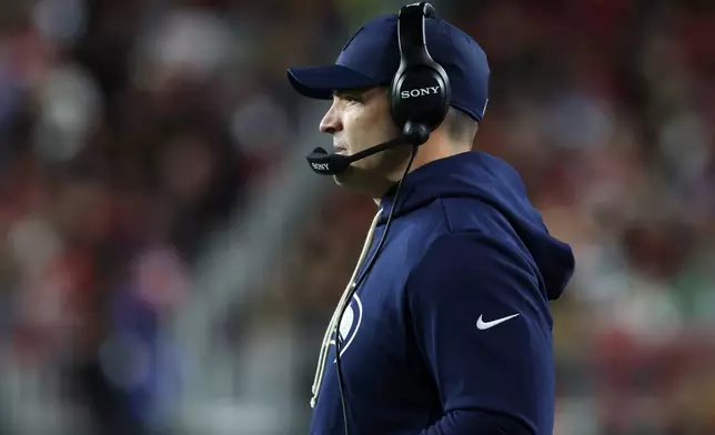 Seattle Seahawks head coach Mike Macdonald watches from the sideline during the second half of an NFL football game against the San Francisco 49ers in Santa Clara, Calif., Saturday, Jan. 3, 2026. (AP Photo/Jed Jacobsohn)