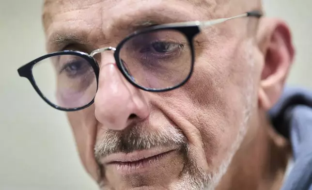David Vallenilla, father of the late David José Vallenilla Luis, sits in his apartment's kitchen in Madrid, Tuesday, Jan. 13, 2026. (AP Photo/Bernat Armangue)