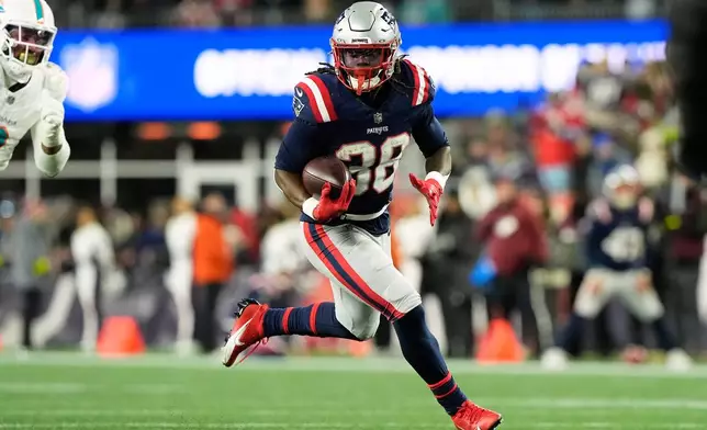 New England Patriots running back Rhamondre Stevenson runs for a touchdown during the second half of an NFL football game against the Miami Dolphins in Foxborough, Mass., Sunday, Jan. 4, 2026. (AP Photo/Robert F. Bukaty)