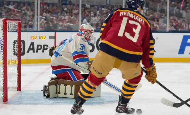 New York Rangers goaltender Igor Shesterkin (31) watches the puck during the first period of the NHL Winter Classic outdoor hockey game against the Florida Panthers, Friday, Jan. 2, 2026, in Miami. (AP Photo/Lynne Sladky)