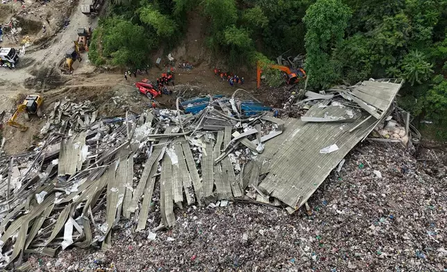 Rescuers continue search operations at a collapsed waste segregation facility in Binaliw, Cebu city, central Philippines on Saturday, Jan. 10, 2026. (AP Photo/Jacqueline Hernandez)