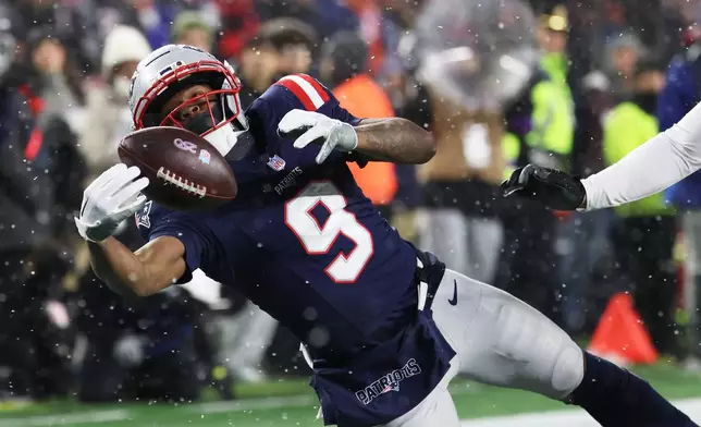 New England Patriots wide receiver Kayshon Boutte (9) catches a touchdown pass against the Houston Texans during the second half of an NFL divisional playoff football game, Sunday, Jan. 18, 2026, in Foxborough, Mass. (AP Photo/Mark Stockwell)