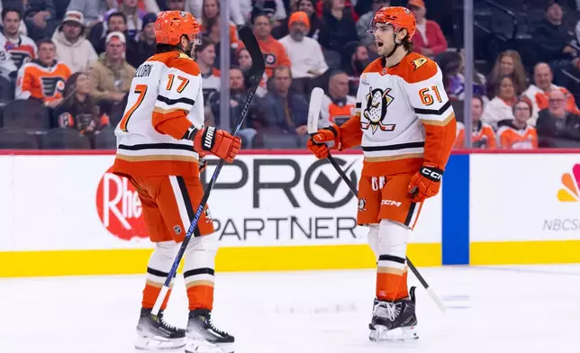 Anaheim Ducks' Cutter Gauthier, right, reacts to his goal with Alex Killorn, left, during the first period of an NHL hockey game against the Philadelphia Flyers, Tuesday, Jan. 6, 2026, in Philadelphia. (AP Photo/Chris Szagola)