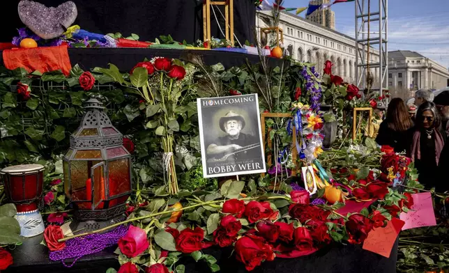 Attendees gather during a public memorial for Grateful Dead co-founder Bob Weir at Civic Center Plaza in San Francisco, Saturday, Jan. 17, 2026. (Stephen Lam/San Francisco Chronicle via AP)