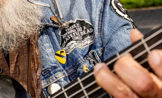 Steven Lewis, a third-generation Bay Area native, plays a guitar during a public memorial for Grateful Dead co-founder Bob Weir at Civic Center Plaza in San Francisco, Saturday, Jan. 17, 2026. (Stephen Lam/San Francisco Chronicle via AP)