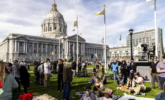 Attendees gather at Civic Center Plaza ahead of a public memorial for Grateful Dead co-founder Bob Weir in San Francisco, Saturday, Jan. 17, 2026. (Stephen Lam/San Francisco Chronicle via AP)