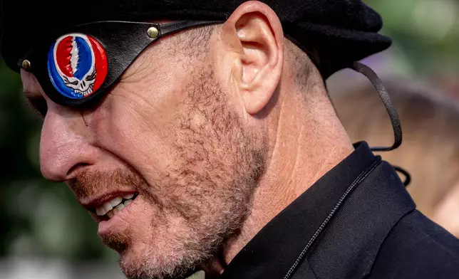 Jonathan Levine, a music executive who worked extensively with the Grateful Dead, wears an eye patch during a public memorial for the band's co-founder Bob Weir at Civic Center Plaza in San Francisco, Saturday, Jan. 17, 2026. (Stephen Lam/San Francisco Chronicle via AP)